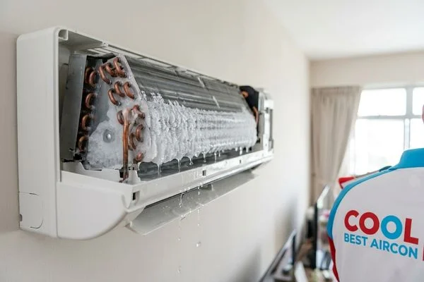 Frozen evaporator coil causing water dripping when ice melts